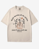 They’re Burning All The Witches Shirt – flat lay ivory tee with funny retro skeletons dancing in fire graphic