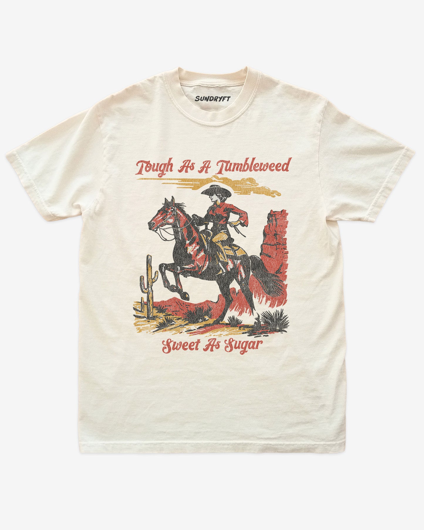 Tough As A Tumbleweed Sweet As Sugar shirt in ivory with distressed retro graphic of cowgirl riding on a horse through desert