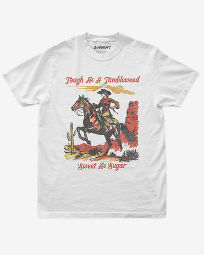 Tough As A Tumbleweed Sweet As Sugar shirt in white with distressed retro graphic of cowgirl riding on a horse through desert