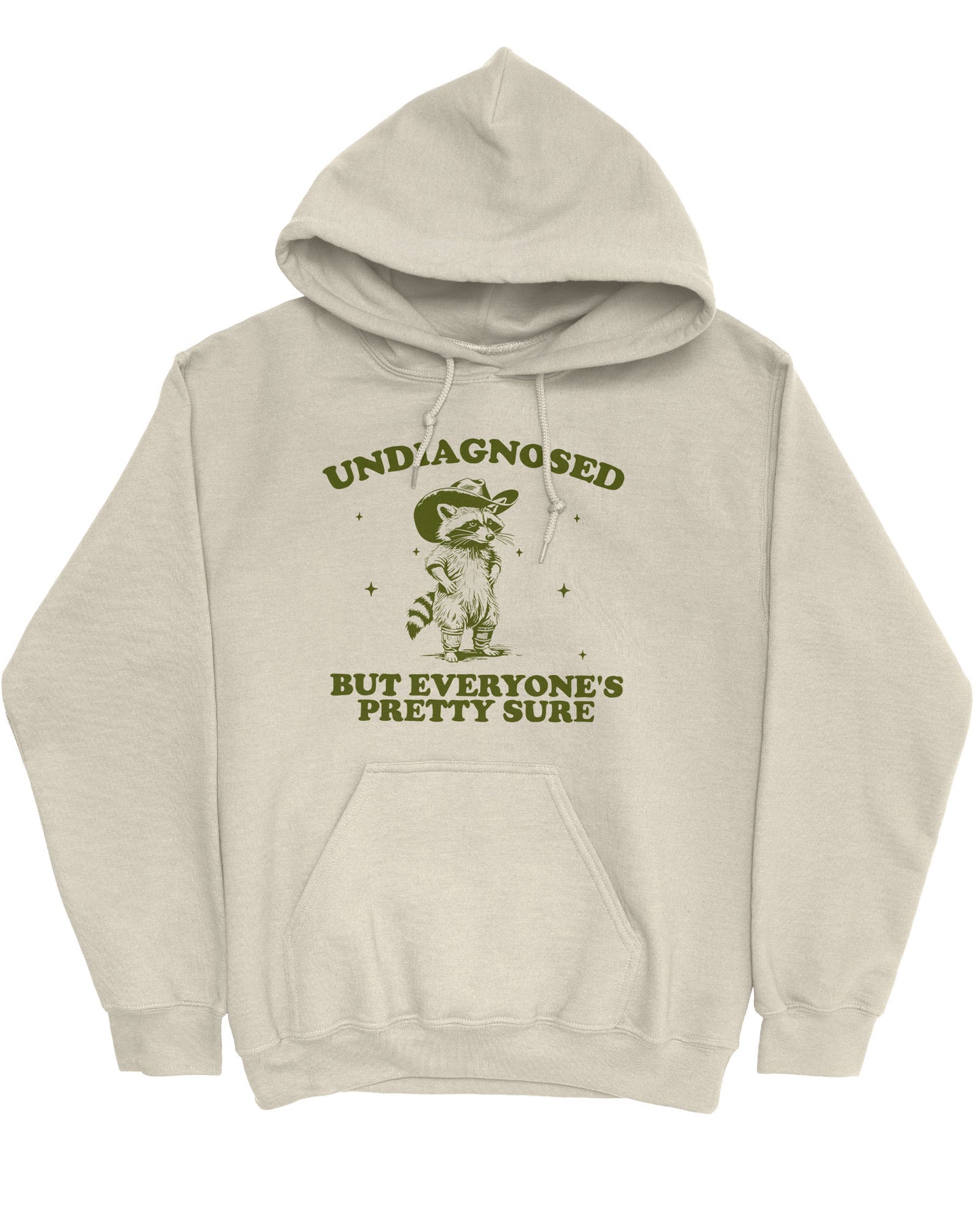 Flat lay sand beige hoodie with a funny retro cowboy raccoon graphic and the quote 'Undiagnosed, But Everyone's Pretty Sure'.