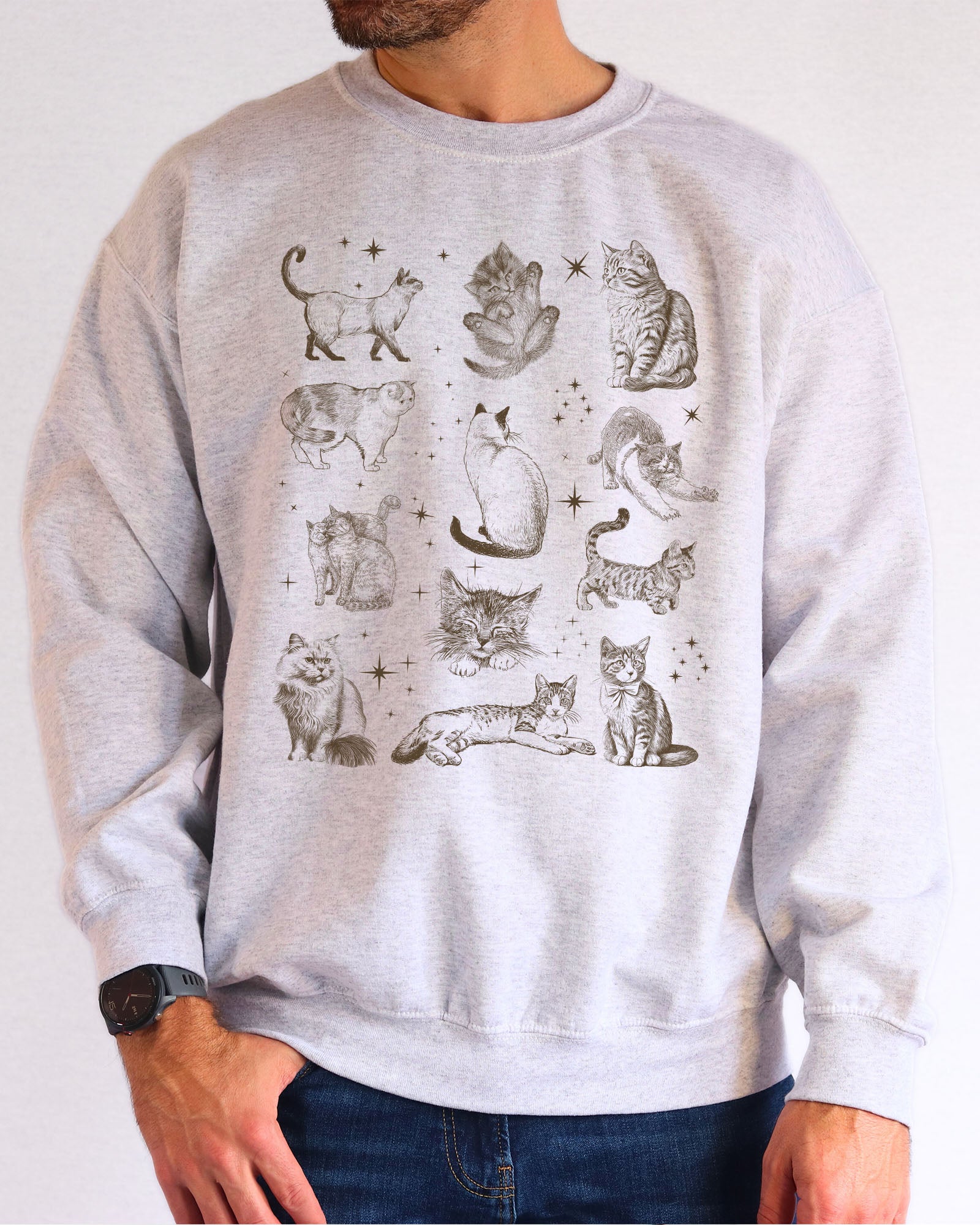 Model wearing ash color sweatshirt with vintage cat collage graphic design