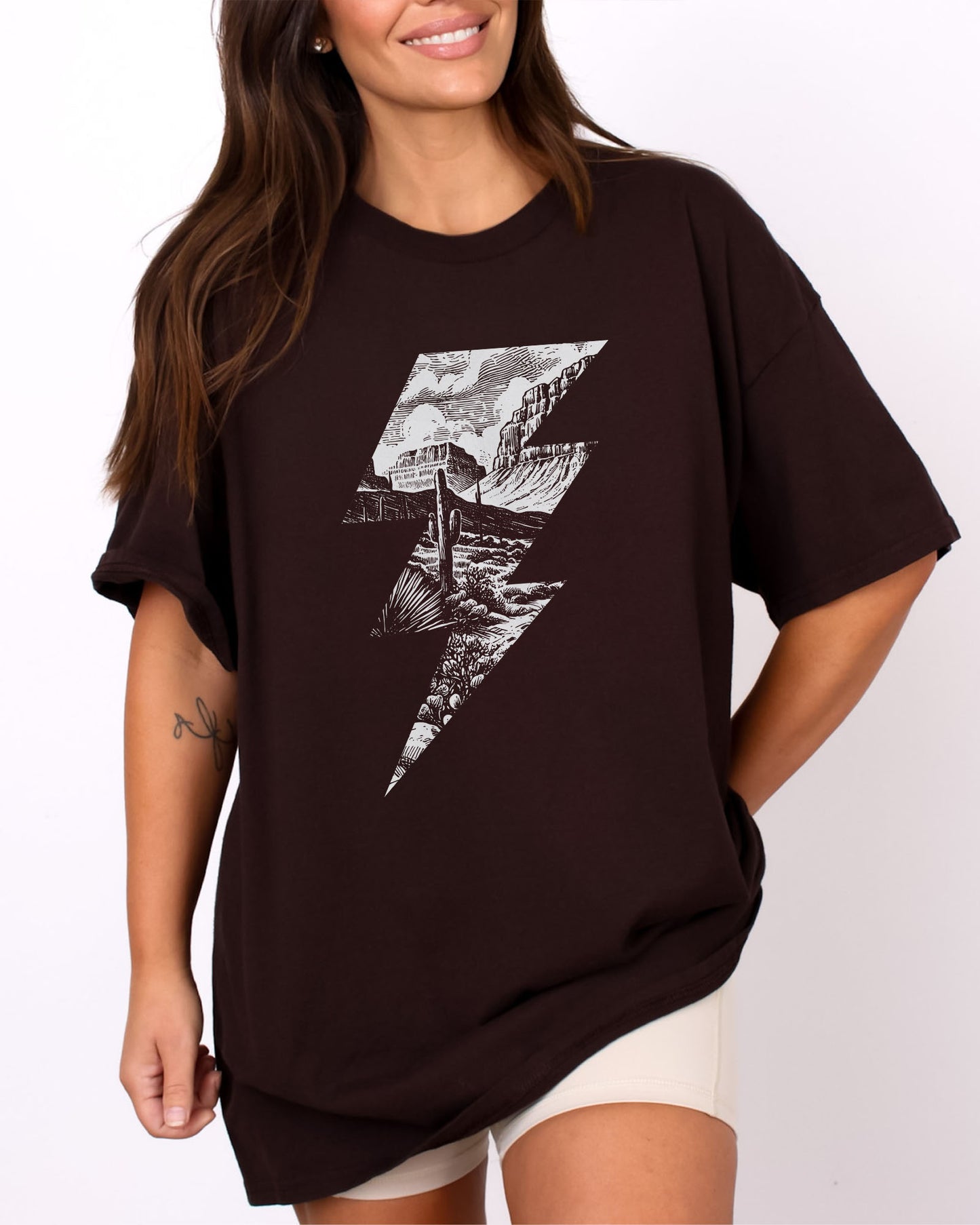Model wearing dark chocolate color shirt with 'Western Lightning Bolt' graphic design