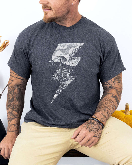Model wearing dark heather color shirt with 'Western Lightning Bolt' graphic design
