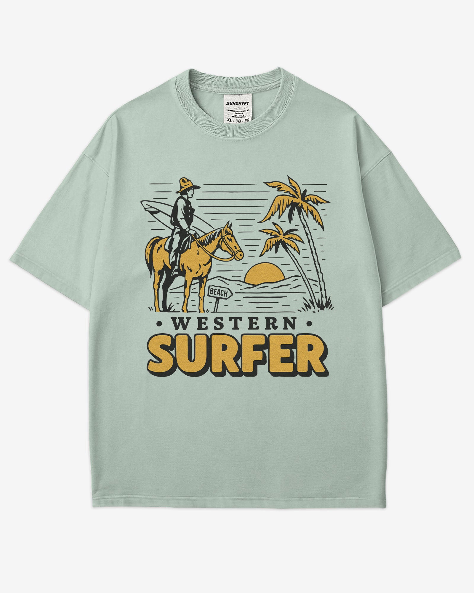 Flat lay bay 'Western Surfer' shirt with a retro graphic of a cowboy on a horse in a desert, following a beach signpost.