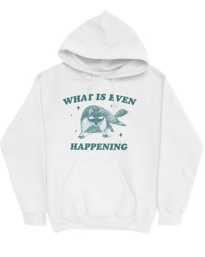 Flat lay of a white-colored 'What Is Even Happening' hoodie featuring a funny retro raccoon graphic.