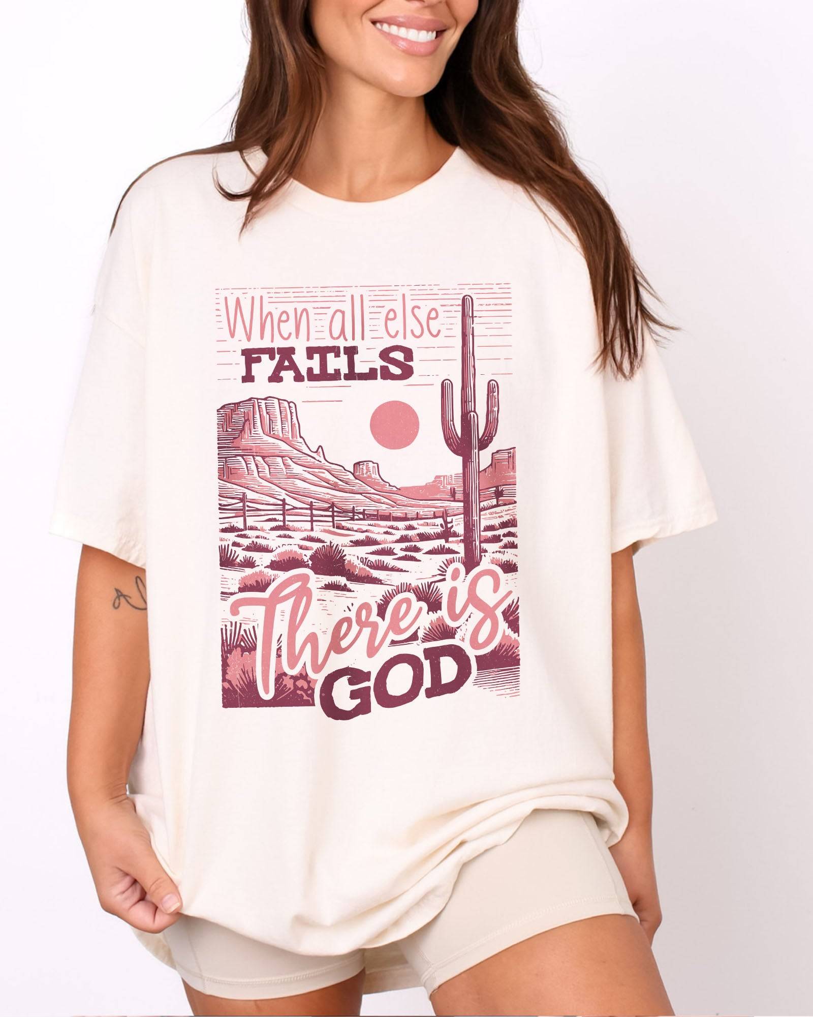 Woman wearing natural color shirt with 'When All Fails There Is God' graphic design