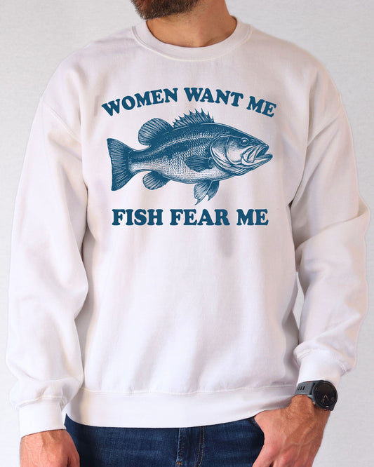 Man wearing a white color sweatshirt with a retro bass fish graphic and the quote 'Women Want Me, Fish Fear Me'.