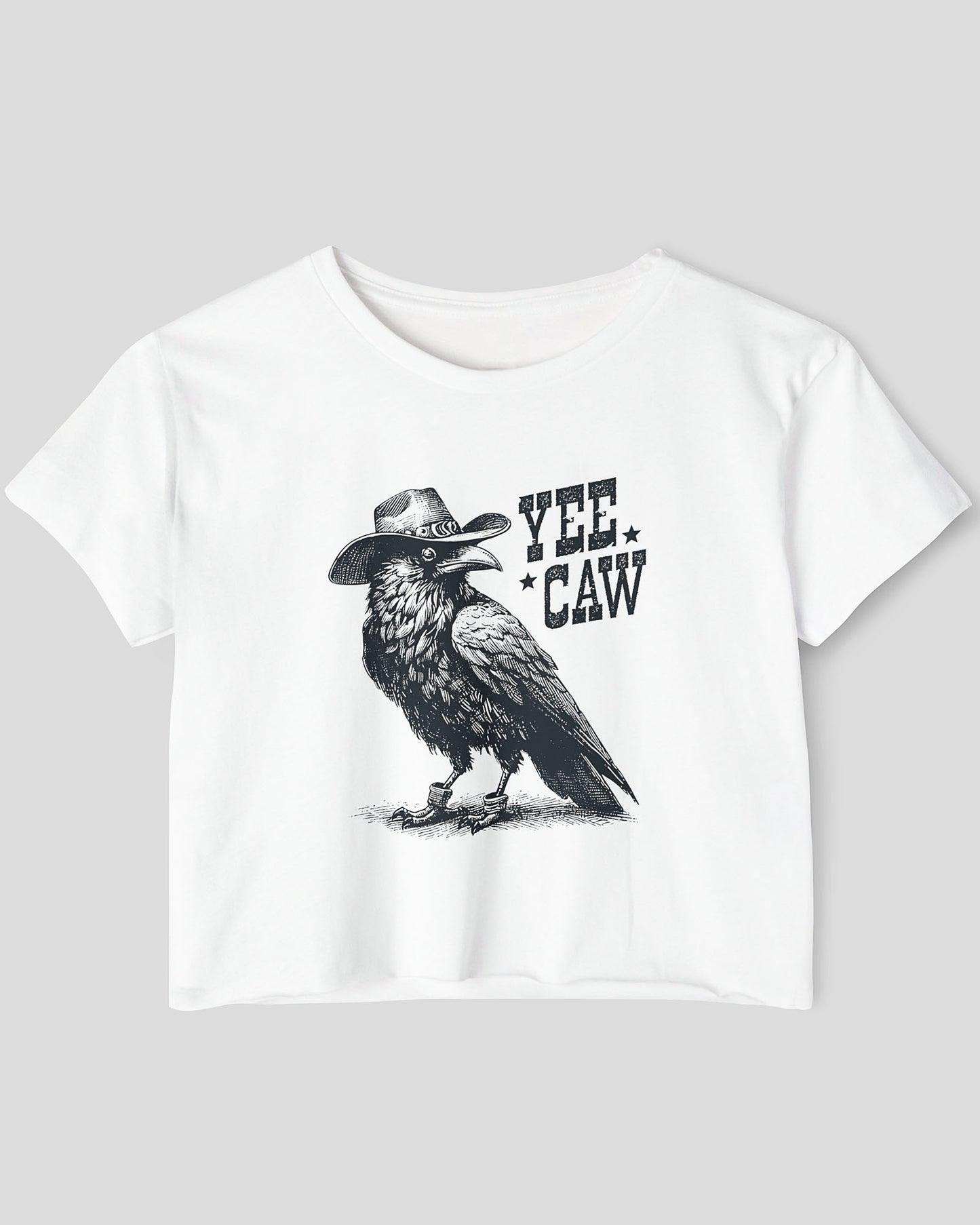 Flat lay white-colored 'Yee Caw' crop top featuring a funny retro cowboy crow graphic.