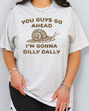 You Guys Go Ahead I'm Gonna Dilly Dally shirt in ash grey color with a retro snale graphic