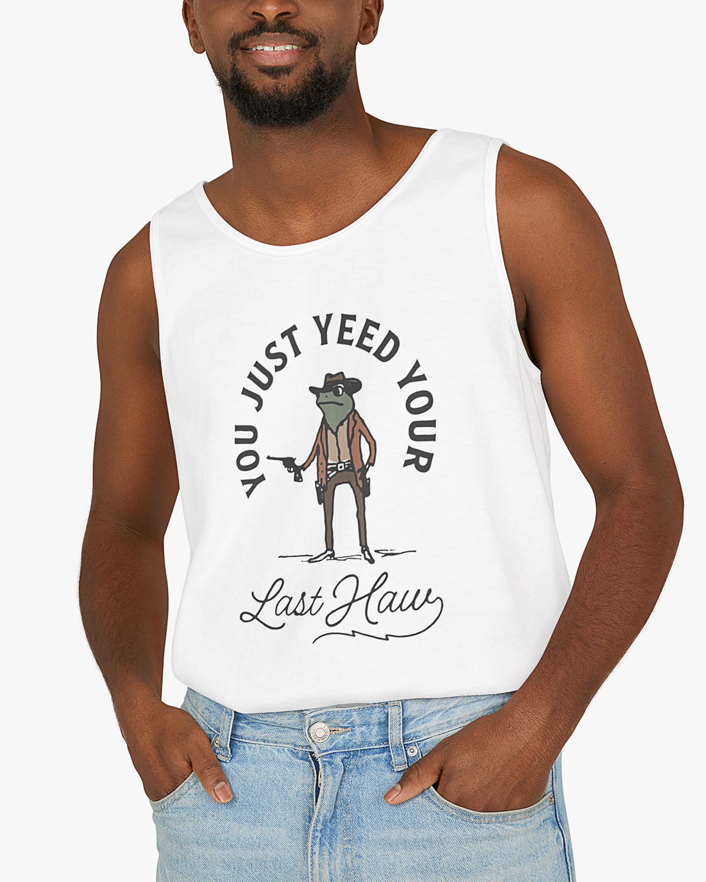 Man wearing white 'You Just Yeed Your Last Haw' tank top with funny retro cowboy frog graphic