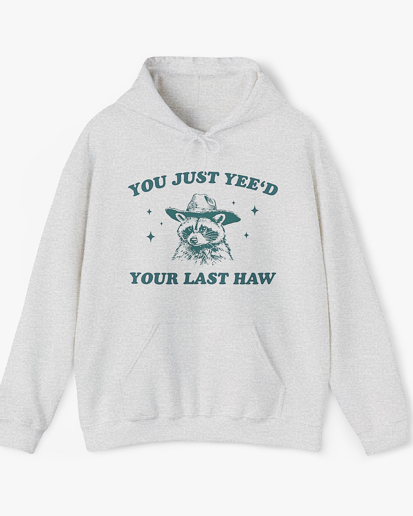 Flat laying ash gray 'You Just Yeed Your Last Haw' hoodie with funny cowboy raccoon graphic