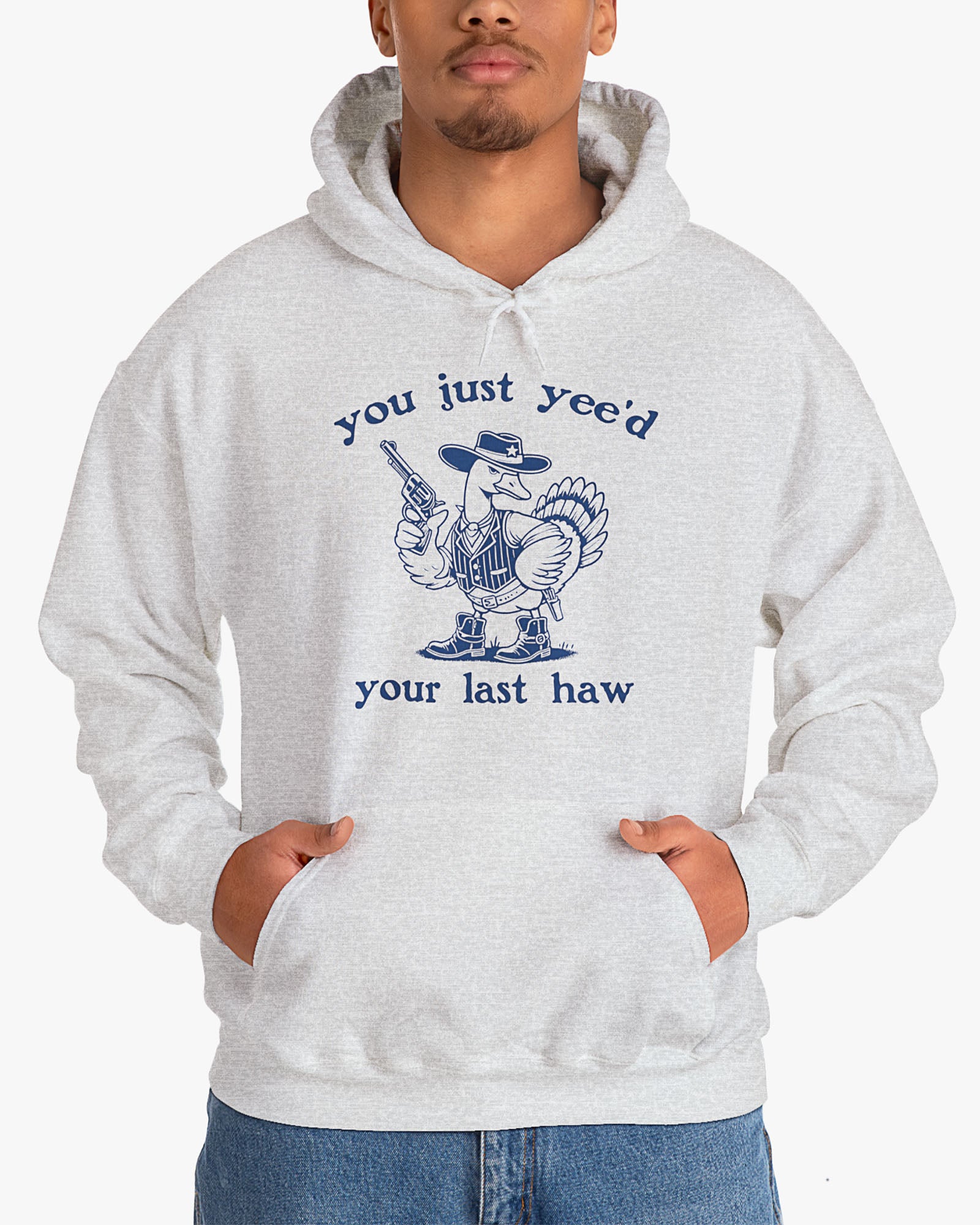 Man wearing ash gray 'You Just Yeed Your Last Haw' hoodie with funny retro cowboy goose graphic