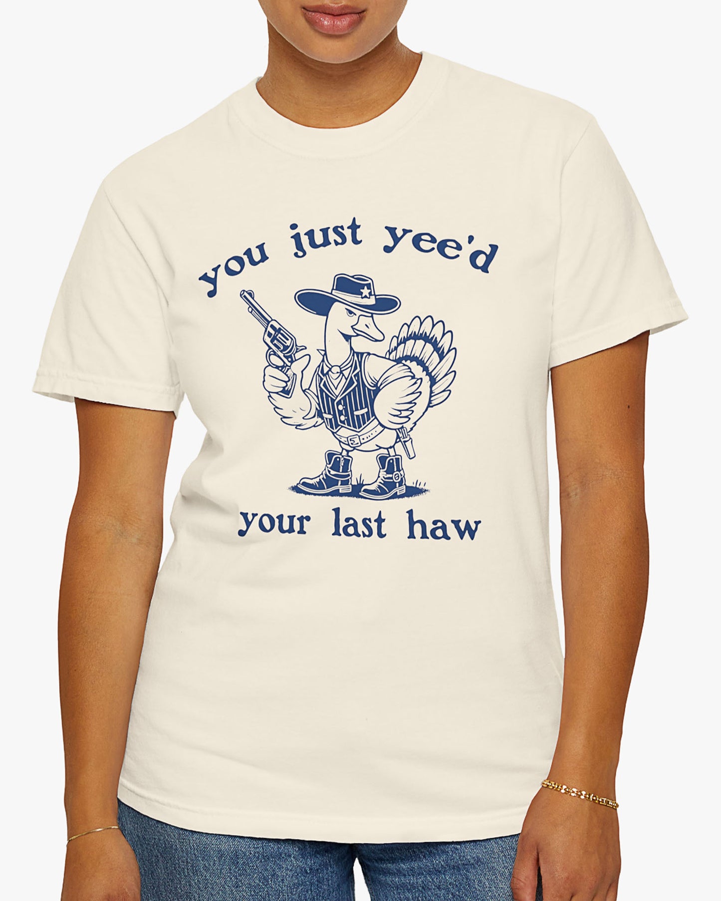 Woman wearing natural 'You Just Yeed Your Last Haw' shirt with funny retro cowboy goose graphic
