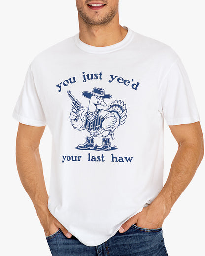 Man wearing white 'You Just Yeed Your Last Haw' shirt with funny retro cowboy goose graphic