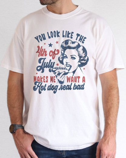 Model wearing white color shirt with 'You Look Like The 4th Of July' graphic design