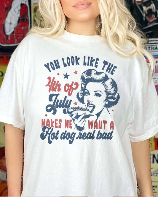 Close-up of model wearing white color shirt with 'You Look Like The 4th Of July' graphic design