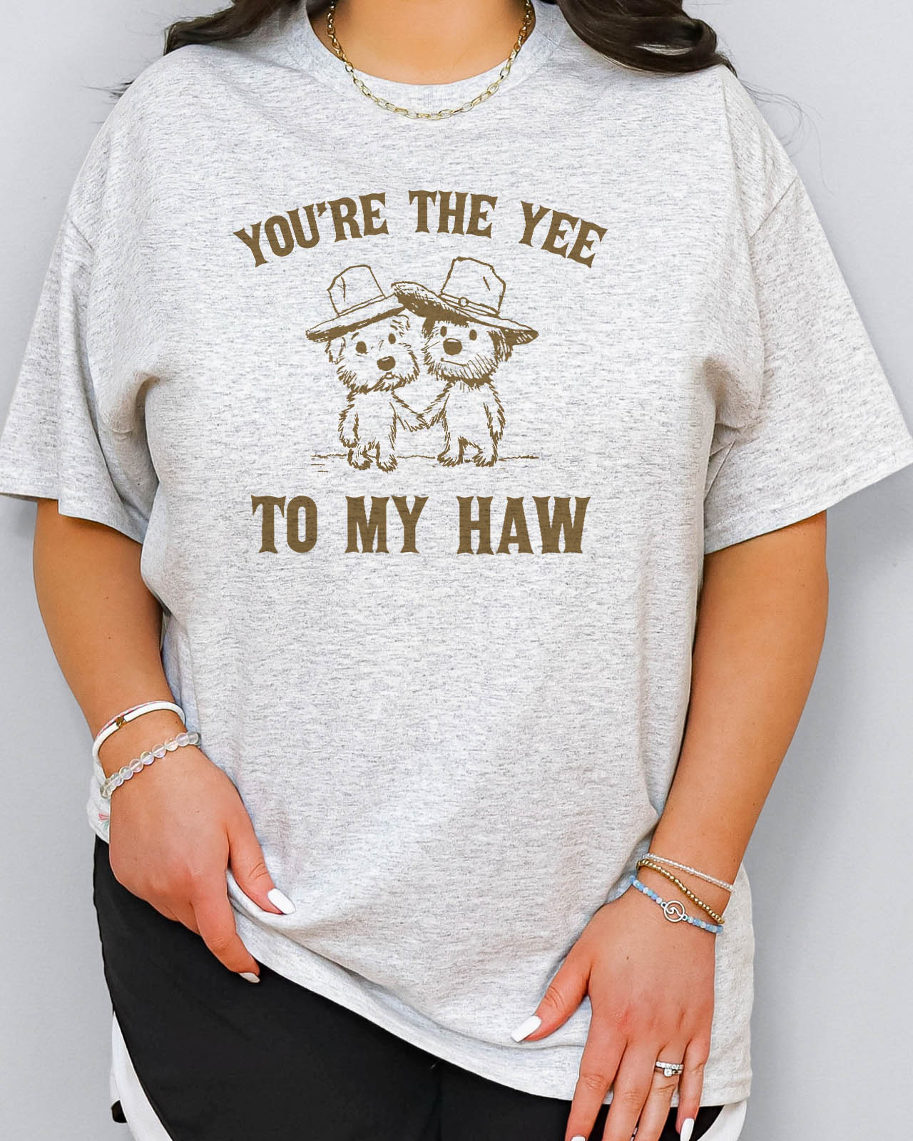 Woman wearing "You're the yee to my haw" shirt in ash grey color