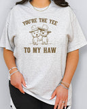 Woman wearing "You're the yee to my haw" shirt in ash grey color