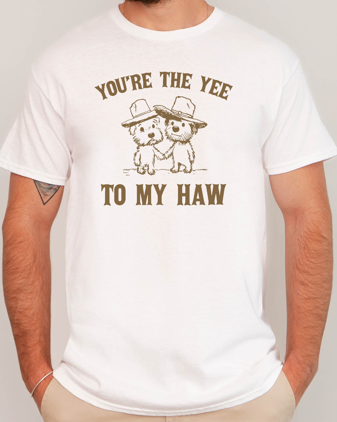 Man wearing "You're the yee to my haw" shirt in white color